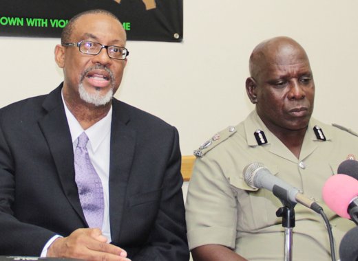Director of Public Prosecution, Colin Williams, left, and Commissioner of Police, Michael Charles, at the launch of the booklet. (IWN photo)