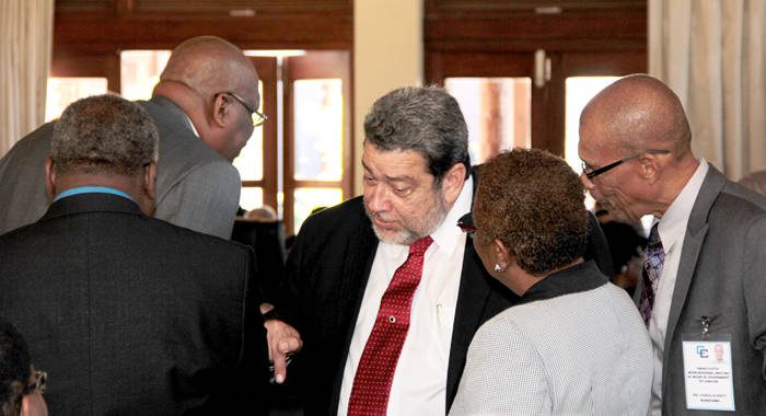 Chair of CARICOM, Prime Minister Ralph Gonsalves, chats with his regional colleagues ahead of the Heads of Government meeting on Monday. (IWN photo)
