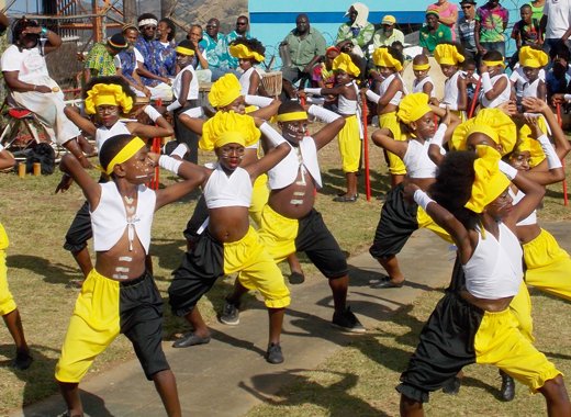 Children perform at the annual Wreath-laying Ceremony at  Dorsetshire Hill honour of National Hero, The Right Excellent Joseph Chatoyer, on Thursday.  