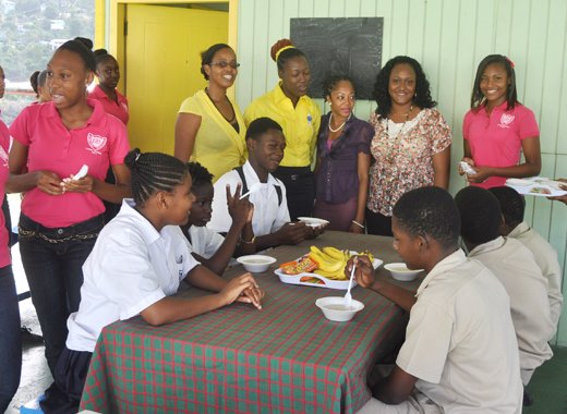 Principal of Intermediate High School, Bernadette Slater-Peters, (in black), Coordinating Teacher, Kimberley Young-Compton Young-Compton, third from right, and other teachers and young leaders.