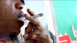 A man smokes a marijuana cigarette in St. Vincent. (IWN file photo)