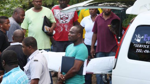 The body of Miranda Williams is removed from the scene on Saturday. (Photo: Karamo John/IWN) 