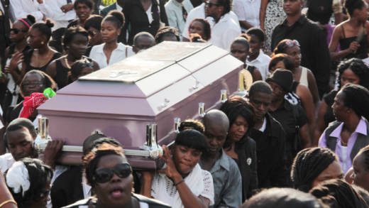 Miranda Williams casket is carried shoulder high during her funeral on Saturday. (IWN photo)