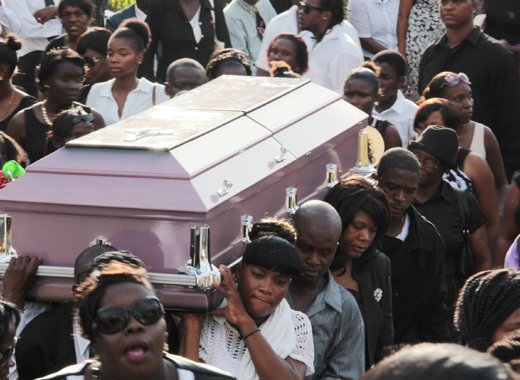 Miranda Williams casket is carried shoulder high during her funeral on Saturday. (IWN photo)