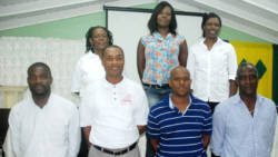 President of the Basketball Federation Junior Sutton, front row third left, and his executive. (Photo: Robertson S. Henry)
