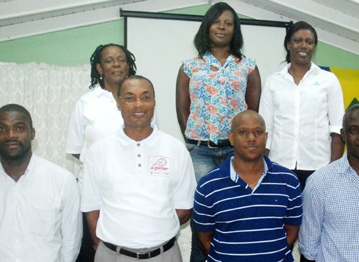 President of the Basketball Federation Junior Sutton, front row third left, and his executive. (Photo: Robertson S. Henry)
