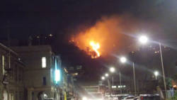 The large bush fire, pcitured here from downtown Kingstown, continued into Monday night.
