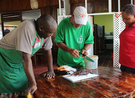 Lorne Saul-Demers demonstrates how to safely fillet a lionfish.