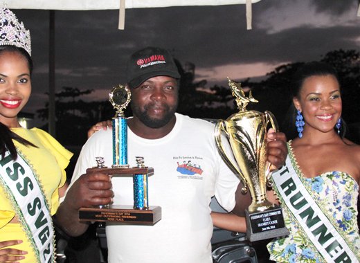 Fisherman of the Year Andrew Gould pose with Miss SVG 2014 Shadeisha George and
First Runner-up Karla Gellizeau. (IWN Photo)