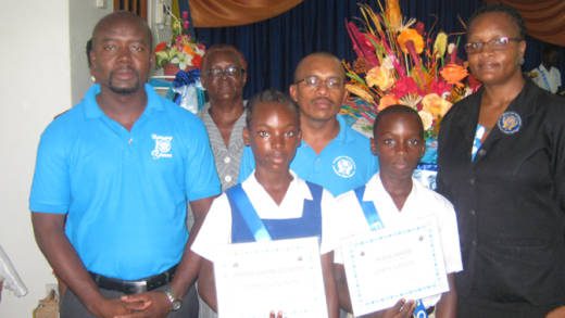 Junior Simmons (President) left, Catherine Cuffy (Director /Chaplain), Collin May (Vice President), Thecla Andrews (Asst. Secretary/Treasurer), and students Andrea Gonsalves and Lewis Nanton.