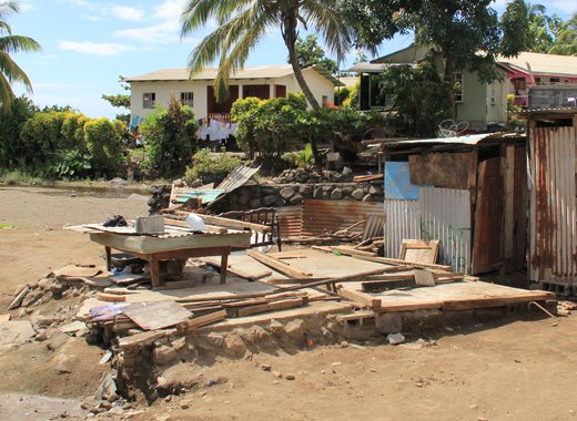 This bed and mattress and pieces of a concrete foundation are all that is left of Florestine Spring' house. (IWN Photo)
