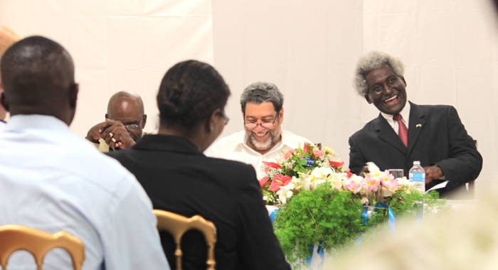 Prime Minister Ralph Gonsalves and U.S. Ambassador Larry Palmer laugh during a ceremony on Tuesday to commission the Coast Guard sub base in Canouan. (IWN photo)