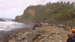 Persons gather on shore in San Souci, where the father and son went missing. (Photo: Manson Shortte/Facebook)