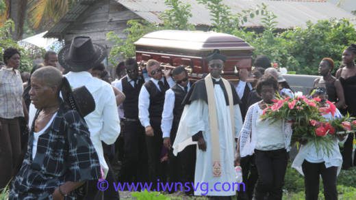 EG Lynch's casket is carried shoulder-high to the cemetery on July 19, 2014. (IWN photo)