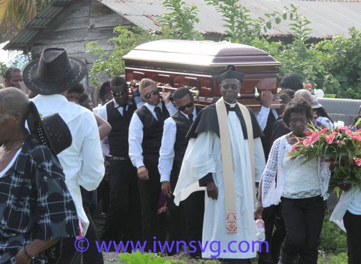 EG Lynch's casket is carried shoulder-high to the cemetery on July 19, 2014. (IWN photo)