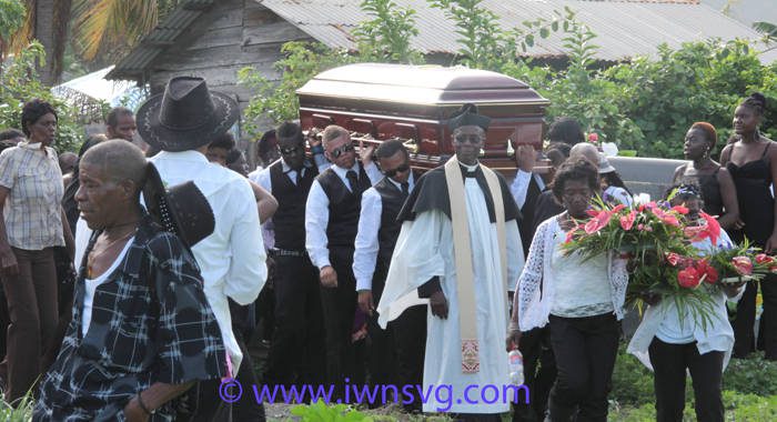 EG Lynch's casket is carried shoulder-high to the cemetery on July 19, 2014. (IWN photo)