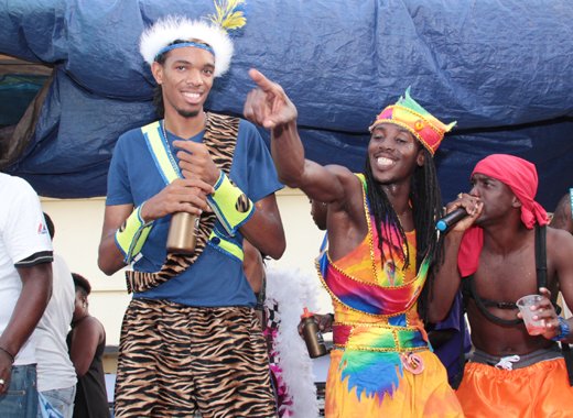 Fireman, centre, and other artiste sing on the road on Tuesday. (IWN photo)