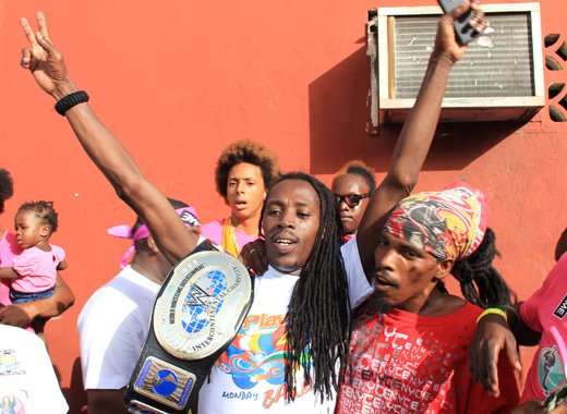 Delroy Fireman Hooper celebrates his soca monarch victories with fans in Kingstown on Monday. He has gone on to win the Road March title. (IWN photo)