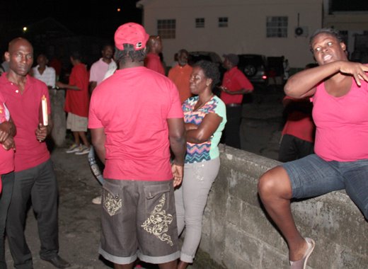 A Grenville Williams supporter expresses dissatisfaction with Jomo Thomas, second left, becoming the candidate. (IWN photo)