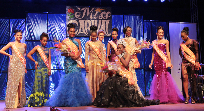 Miss Carival 2014: Miss Dominica Francine Baron, surrounded by the other contestants in the pageant, gives a thumbs-up after her crowning. (IWN Photo)