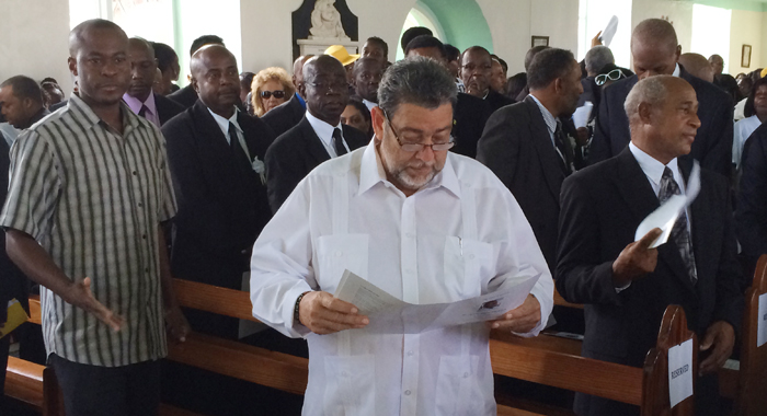 PM Gonsalves reviews the funeral programme. (IWN photo)