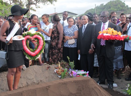Shafia London, and Keino Spring, prepare to lay wreaths on the grave of thier father, E.G. Lynch. (IWN photo)
