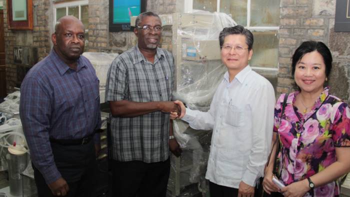 Ambassador Weber Shih handed over the medical equipment and supplies to Minister of Health, Clayton Burgin. (IWN photo) 