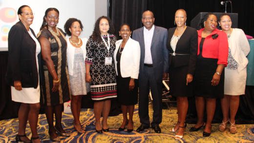 Telecomms executives pose after the launch of the forum in Nassau. 