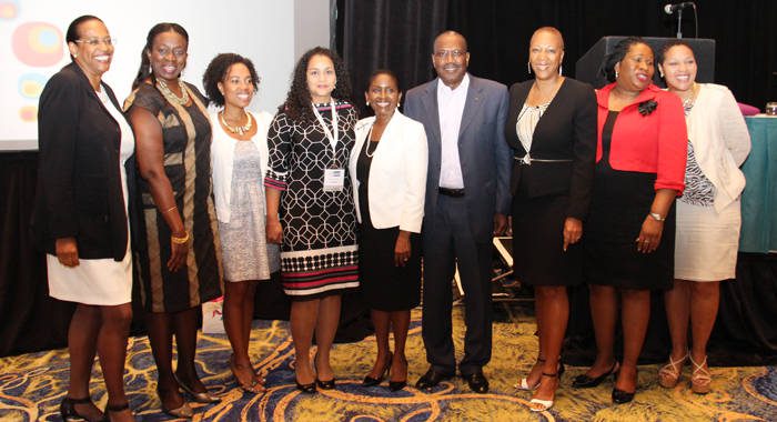 Telecomms executives pose after the launch of the forum in Nassau. 