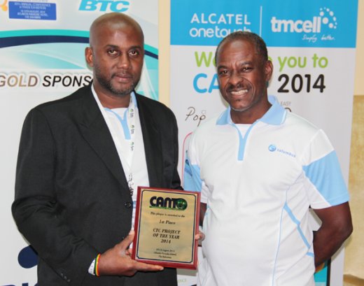 Kyron Duncan of the NTRC and Director of Telecommunications, Jerrol Thompson pose with the award. (Photo: Kenton X. Chance)