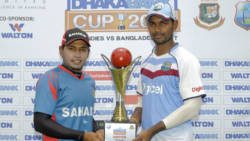 Tightest hold: Captains Mushfiqur Rahim (Ban) and Denesh Ramdhin (WI) pose with Dhaka Bank Trophy.
