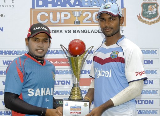 Tightest hold: Captains Mushfiqur Rahim (Ban) and Denesh Ramdhin (WI) pose with Dhaka Bank Trophy.