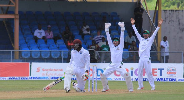 Bangladeshi players appeal as a Shuvatata Hom delivery hits Chris Gayles pad. He was later given out LBW on referral. (IWN photo)