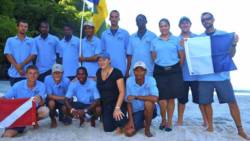Kay Wilson, in black, and the staff of Indigo Watersports Ltd. (Internet photo)