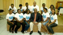 President of the NDP, Arnhim Eustace pose with Young Democrats after the launch of the app. (IWN Photo)