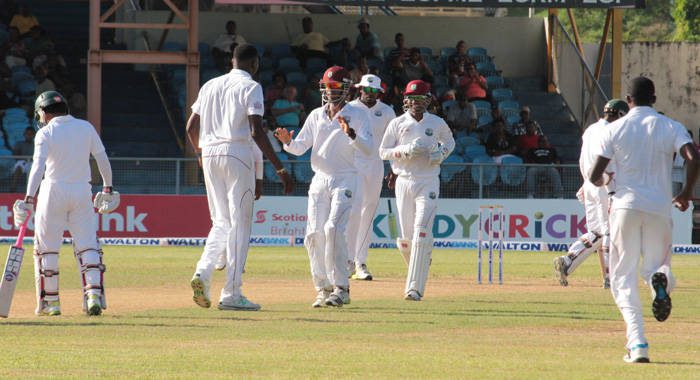 Sulieman Benn, who took 5 wickets for the Windies, being congratulated by teammates (IWN photo)