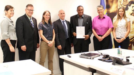 Dominic Stowe  poses with his certificate and facilitators after the training in Miami.