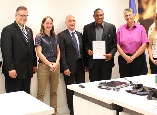 Dominic Stowe  poses with his certificate and facilitators after the training in Miami.