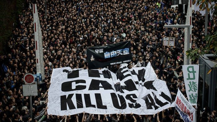 Protesters display a large banner during a rally to support press freedom in Hong Kong. (Photo: Philippe Lopez via AFP/Getty Images)