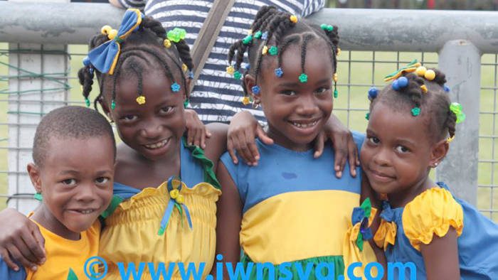 Children wear national colours at the 2013 Independence parade. The leaders of SVGs main political parties have shared their views on what the future holds for Vincentians. (IWN photo)