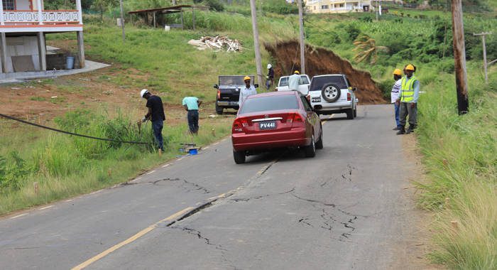 Vehicles drive along the Argyle main road on Saturday, where cracks began to appear on Friday. (IWN photo)