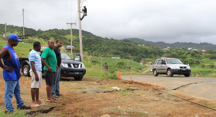General Manager Of Cwsa Garth Saunders, Right, And Other Cwsa Staff At The Site  On Saturday. (Iwn Photo)