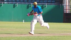 Bill Edwards (34) scrambles the fifth run in what turned out to be 9 runs off a single delivery. (Photo: E. Glenford Prescott)