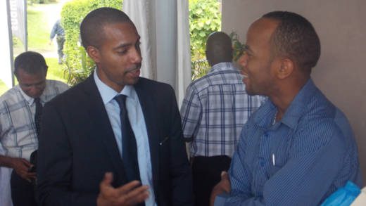 Columbus Communications SVG country manager, Christopher Gordon, and Sen. Luke Brown share a light moment