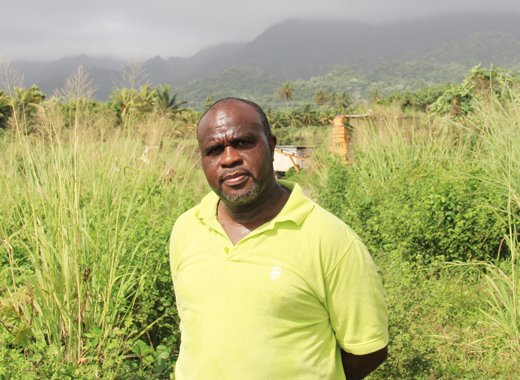 Businessman Leon "Bigger Bigs" Samuel stands on his lands in Rabacca on Oct. 4, 2014. (IWN photo)