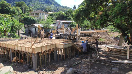 The HLDC has told its paying clients that their houses were delayed by the response to the December disaster. Since then the HLDC has built scores of free houses for disaster victims, including these under construction in Penniston. (IWN photo)
