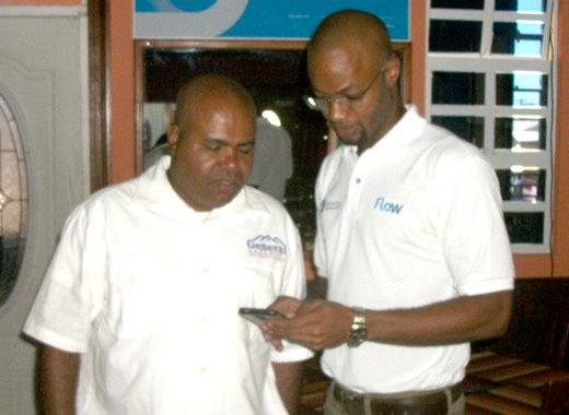 Corey Garrett of FLOW, right and restaurateur, Leonette Anderson testing a new FLOW hot spot after installation.