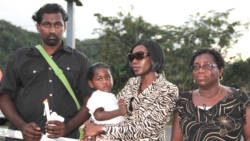 From left: Ricky Small, husband of missing woman Jozel Morgan-Small, Morgan-Small's sister, Dianna Browne and the Small's baby, and Morgan Small's, Patricia Browne. (IWN photo)