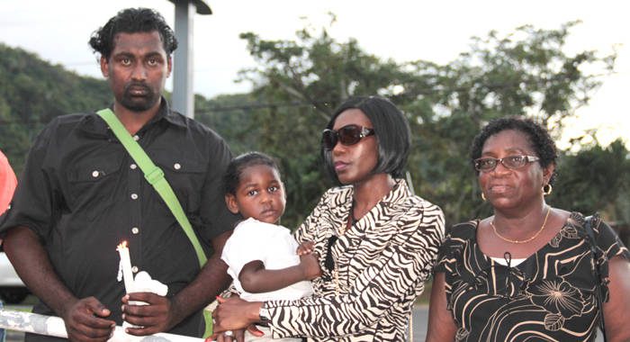 From left: Ricky Small, husband of missing woman Jozel Morgan-Small, Morgan-Small's sister, Dianna Browne and the Small's baby, and Morgan Small's, Patricia Browne. (IWN photo)