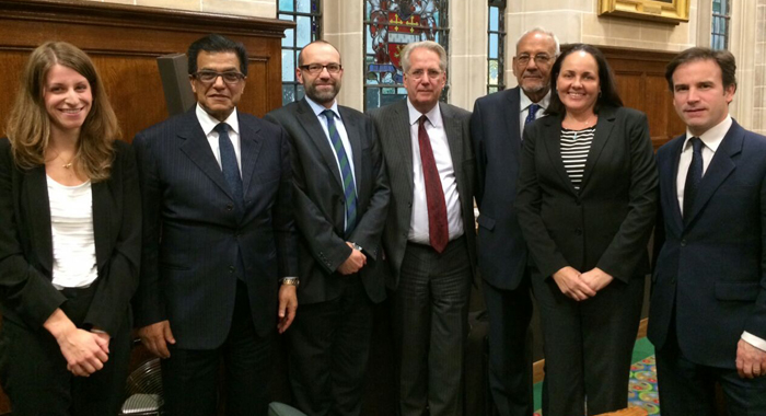 Sir James, third from right, and his legal team in London on Nov. 17, including his daughter, Louise Mitchell-Joseph, second from right. 